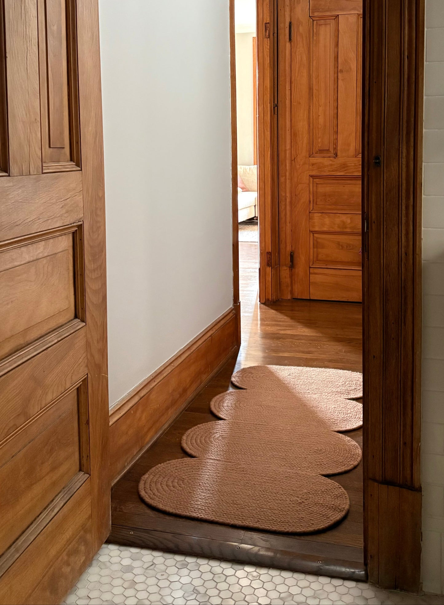 hallway with a curvy wavy wool runner in clay